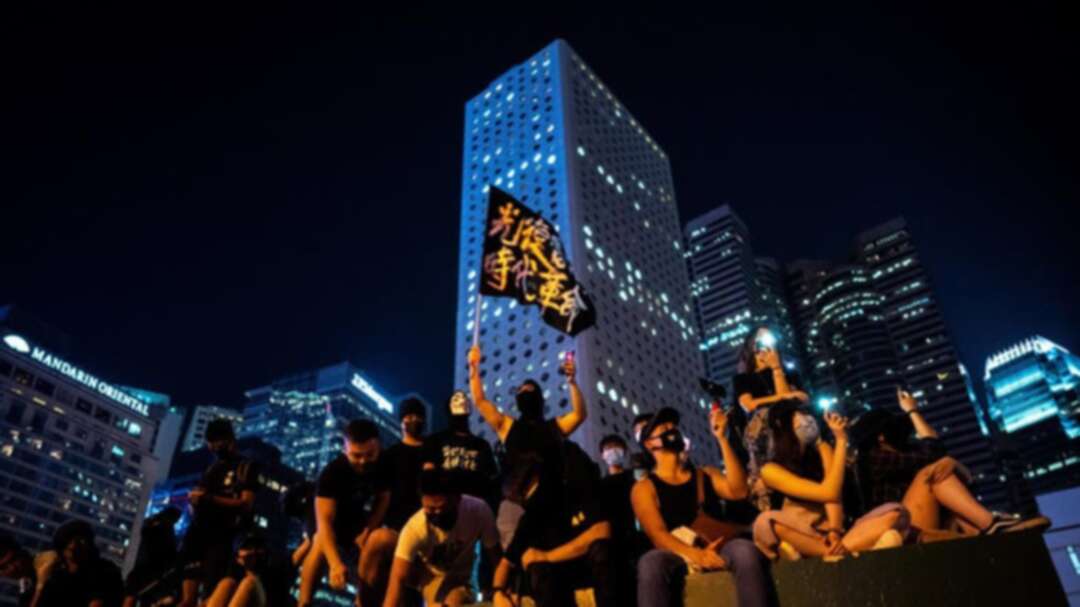 Hong Kong protesters block traffic, taunt police