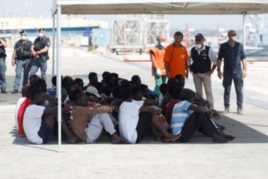 Migrants disembark from German rescue ship seized in Italy