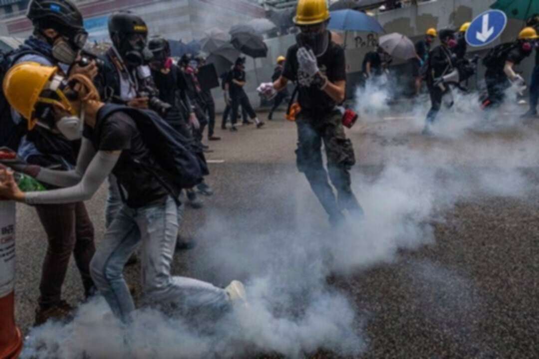 Hong Kong police fire tear gas to try to clear protesters