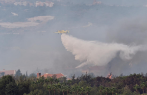 Interior Minister Raya El Hassan shared on Twitter images of Cypriot helicopters extinguishing the fire in Lebanon's Chouf mountains. (Twitter)