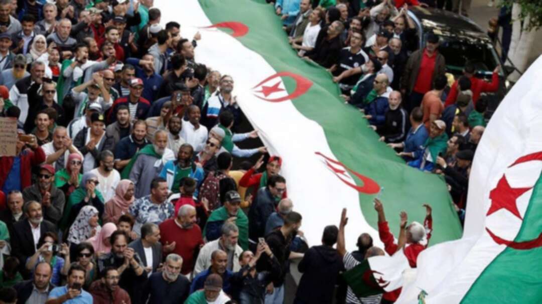 Algerians protest election plan, mark independence war