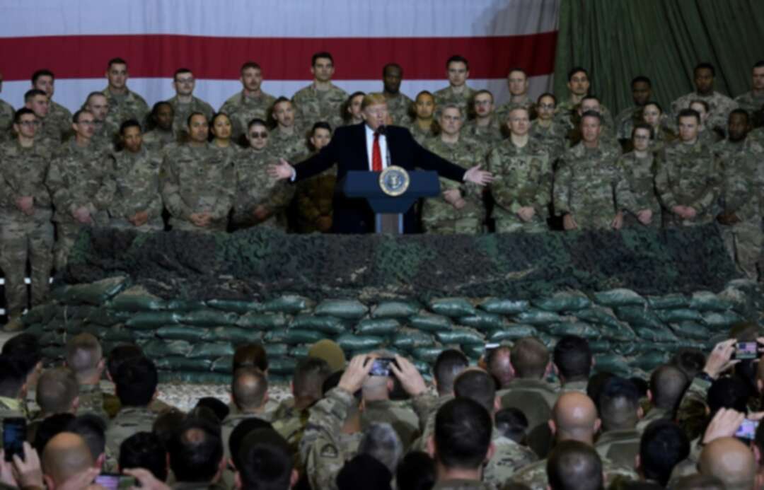 Trump visits troops in Afghanistan, says Taliban talks back on