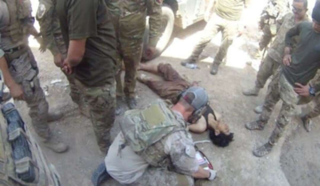 إدانة قائد عسكري أمريكي لالتقاطه صورة بجوار جثة معتقل عراقي