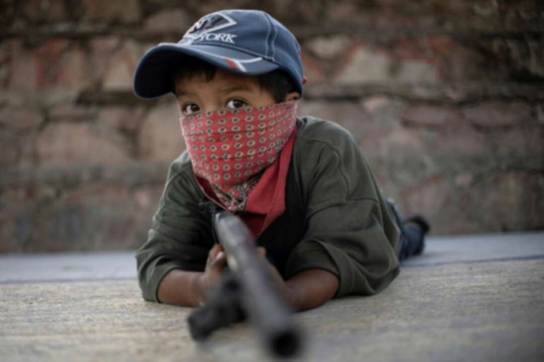 Mexican children take up arms in fight against drug gangs