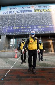 Korean staff disinfect the area outside the Shincheonji Church of Jesus, South Korea, amid a coronavirus outbreak. (AFP)
