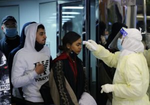 Passengers coming from China wearing masks to prevent a new coronavirus are checked by Saudi Health Ministry employees upon their arrival at King Khalid International Airport, in Riyadh, Saudi Arabia, January 29, 2020. (Reuters)