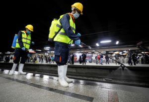 A member of medical team sprays disinfectant as a precautionary move amid concerns over the coronavirus disease (COVID-19) outbreak at the underground Al Shohadaa Martyrs metro station in Cairo, Egypt on March 22, 2020. (Reuters)
