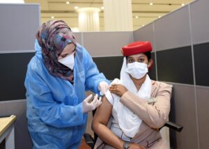 An Emirates flight attendant gets a COVID-19 (coronavirus) vaccine in Dubai, United Arab Emirates. (Emirates)