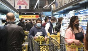 People shop at a supermarket ahead of a tightened lockdown and a 24-hour curfew to curb the spread the coronavirus disease (COVID-19) outbreak in Beirut. (Reuters)