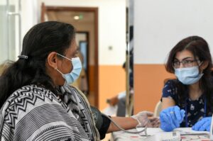 A woman gets tested before receiving a dose of a vaccine against the coronavirus at St. Paul's Church in Abu Dhabi. (Reuters)