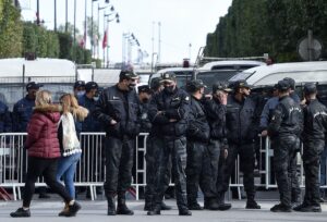 Members of the Tunisian police block the Habib Bourguiba Avenue during an anti-government demonstration in the capital Tunis, on January 23, 2021. (Fethi Belaid/AFP)