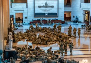 Hundreds of National Guard troops hold inside the Capitol Visitor's Center to reinforce security at the Capitol in Washington, Wednesday, Jan. 13, 2021. The House of Representatives is pursuing an article of impeachment against President Donald Trump. (AP)