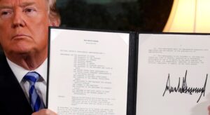 U.S. President Donald Trump holds up a proclamation declaring his intention to withdraw from the JCPOA Iran nuclear agreement after signing it in the Diplomatic Room at the White House in Washington, U.S. May 8, 2018. (Reuters)