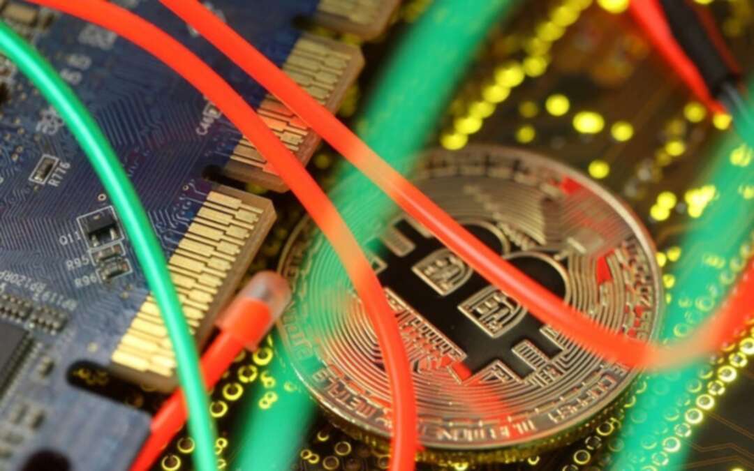 Representation of the Bitcoin virtual currency standing on the PC motherboard is seen in this illustration picture, February 3, 2018. (Reuters)