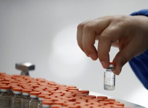 A worker performs a quality check in the packaging facility of Chinese vaccine maker Sinovac Biotech, developing an experimental coronavirus disease (COVID-19) vaccine. (Reuters)