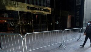 A person walks on the sidewalk outside Trump Tower amid the coronavirus disease (COVID-19) pandemic in the Manhattan borough of New York City, New York, U.S., January 12, 2021. (Reuters)