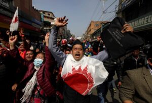 Supporters of a faction of the ruling Nepal Communist Party take part in a rally celebrating the reinstatement of the parliament by Nepal’s top court in Kathmandu, Nepal, on February 24, 2021. (Reuters)