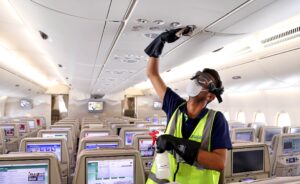 A member of cleaning staff wearing protective mask disinfects air vents of an Emirates Airbus A380. (Rueters)