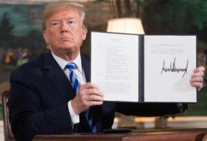 President Trump signs a document reinstating sanctions against Iran after announcing the US withdrawal from the Iran Nuclear deal at the White House on May 8, 2018. (AFP)