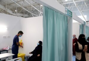 A Saudi woman waits to get a dose of a coronavirus disease (COVID-19) vaccine, in Riyadh. (Reuters)