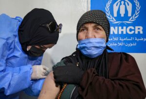 A Syrian refugee receives the Coronavirus vaccine, at a medical center in the Zaatari refugee camp, 80 kilometers (50 miles) north of the Jordanian capital Amman on February 15, 2021. (File photo: AFP)