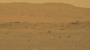 This video grab made from a NASA live stream on April 19, 2021 shows the agency's Ingenuity Mars Helicopter flying over the surface of Mars. (File photo: AFP)