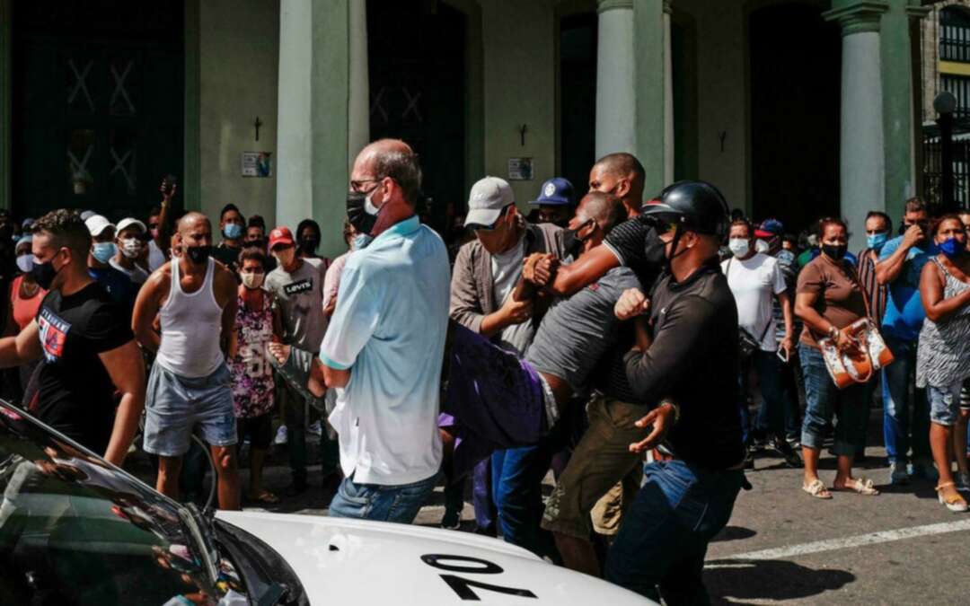 Thousands of Cubans take part in protests against the communist government