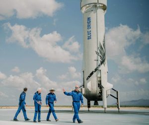 blue-origin-first-human-flight-crew-visits-landed-booster-bgversion