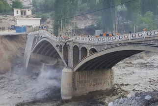 Flash flooding sweeps away bridge in northern Pakistan