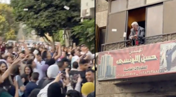 تجمهر عشرات المصريين تحت شرفة مهندس قام بإلقاء الأموال عليهم بمناسبة العيد! (فيديو)