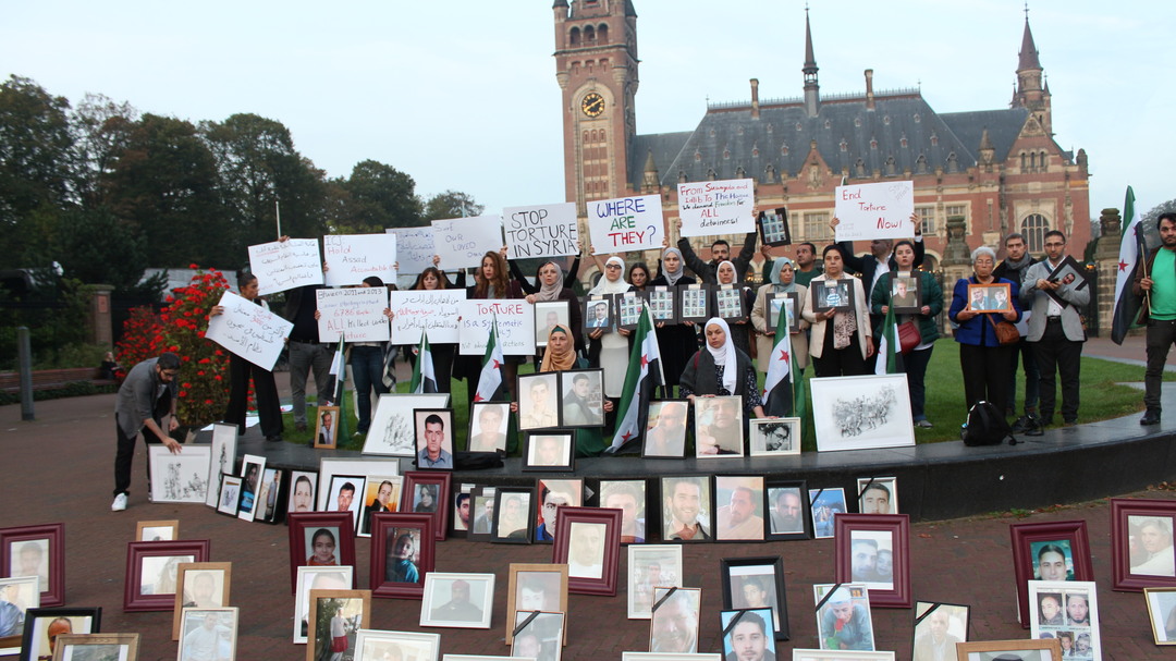 Families of Syria’s disappeared and survivors of torture call for an end to torture outside landmark International Court of Justice case